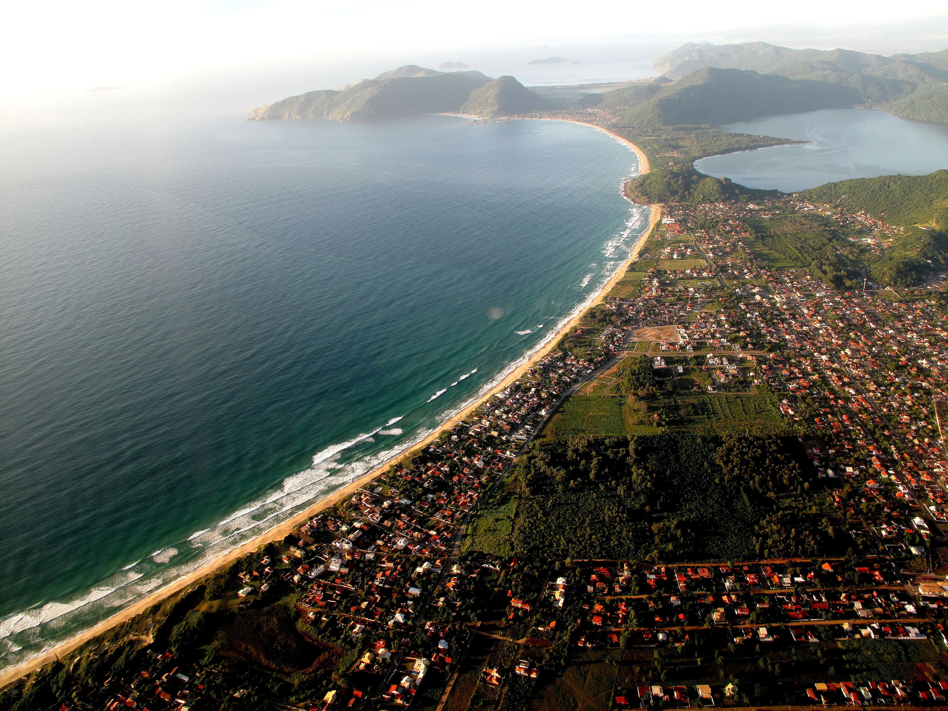 Aerial view of the beaches and green hills of Florianópolis island, Santa Catarina, one of the safest cities in Brazil for expats